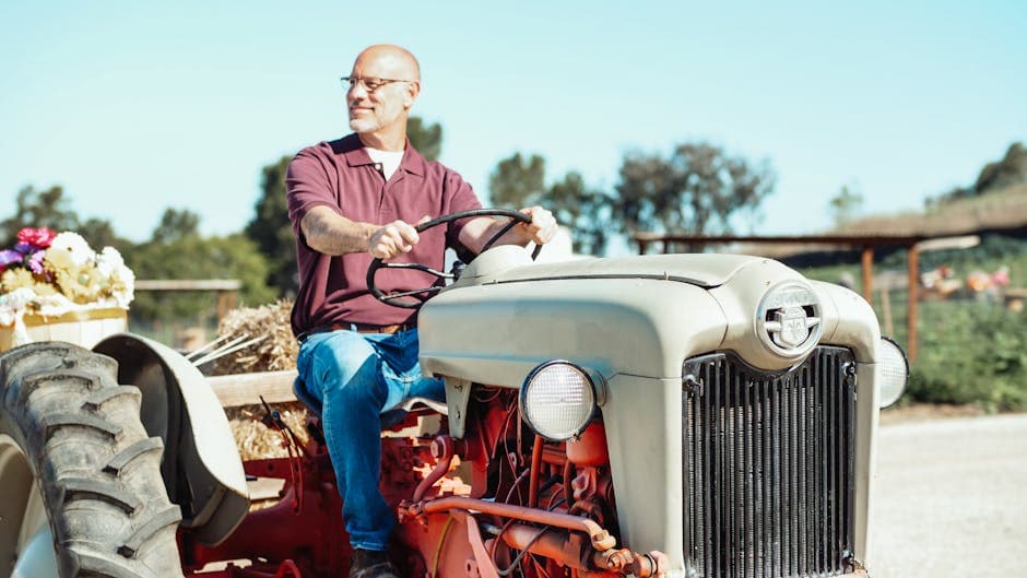 Farmer using a GPS guidance app while driving a tractor